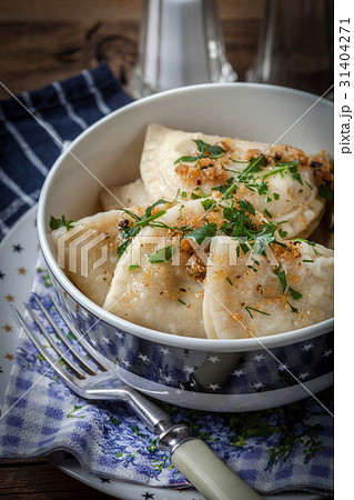 Dumplings with meat, onion and bacon. 31404271