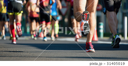 Marathon running race, people feet on city road Marathon running race, people feet on city road 31405019