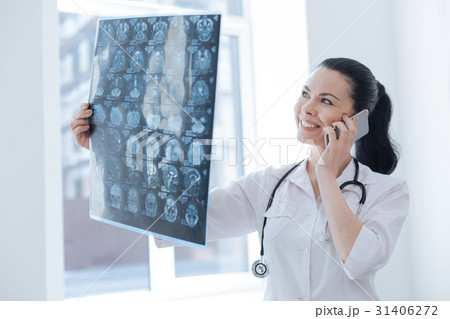 Charming medic discussing roentgen image in the 31406272