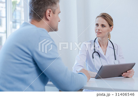 Attentive physician listen to patient complaint in Attentive physician listen to patient complaint in 31406546