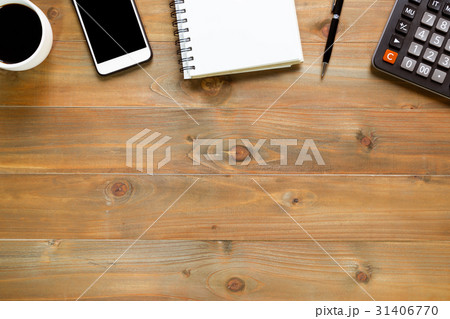 notepad on wooden office desk with smartphone 31406770