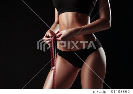 The fit woman measuring perfect shape of beautiful 31408369