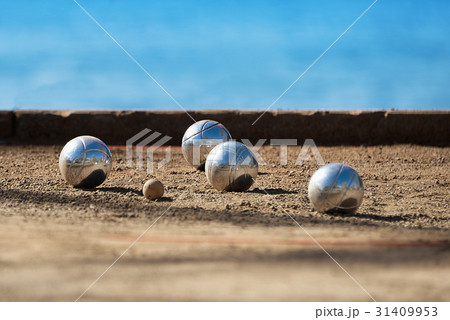 Metallic petanque four balls and a small wood jack 31409953