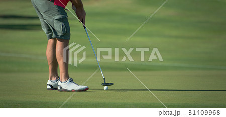 Playing golf preparing to shot 31409968