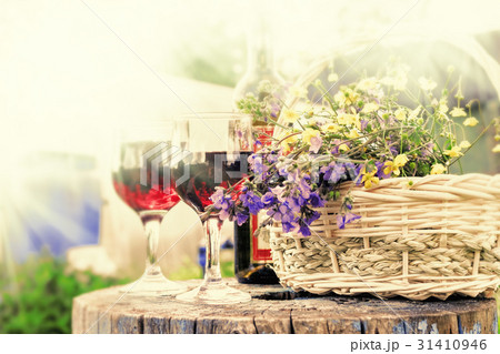 Glasses with red wine and flowers 31410946