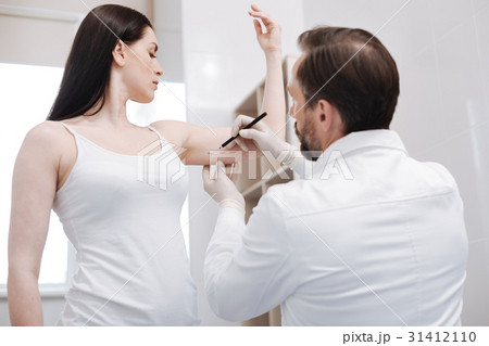 Smart young woman showing which areas she wanting 31412110