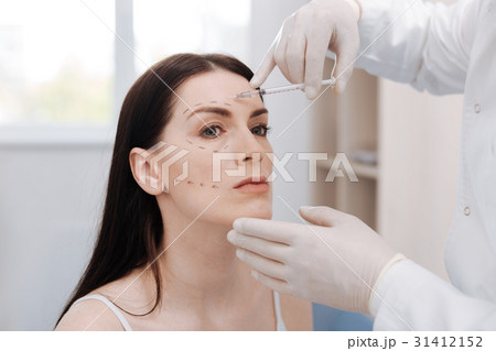 Graceful young lady trusting her face to 31412152