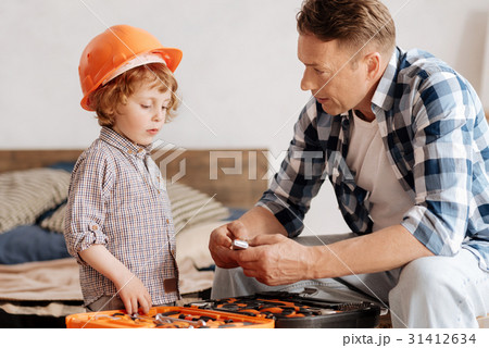 Serious father talking to his little son Serious father talking to his little son 31412634