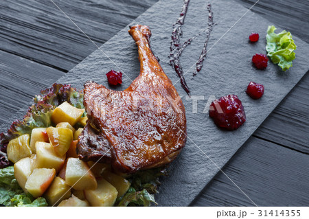 Roasted duck leg, restaurant food closeup 31414355