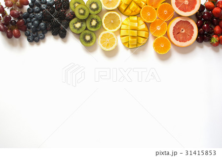 Top view of rainbow fruits on white 31415853