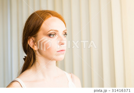 Beautiful model girl with shiny red straight long Beautiful model girl with shiny red straight long 31416371