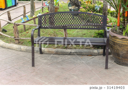 metal brown chair in the park Outdoors. metal brown chair in the park Outdoors. 31419403