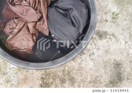 Soak dirty clothes in the basin black for clean Soak dirty clothes in the basin black for clean 31419443