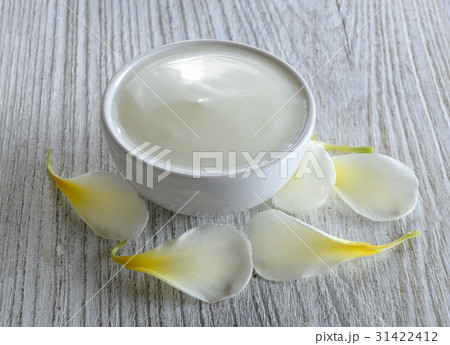 yogurt in white bowl on wood 31422412