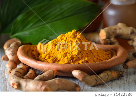 Turmeric powder on wooden background 31422530