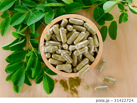 Moringa leaves and capsules (Herbs for health) 31422724