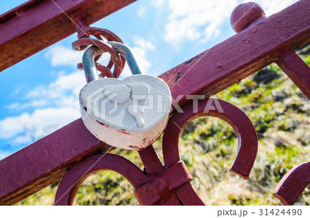 A white heart-shaped love padlock 31424490