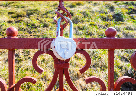 A white heart-shaped love padlock 31424491