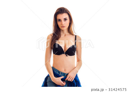 beautiful young brunette stands in the Studio in a 31424575