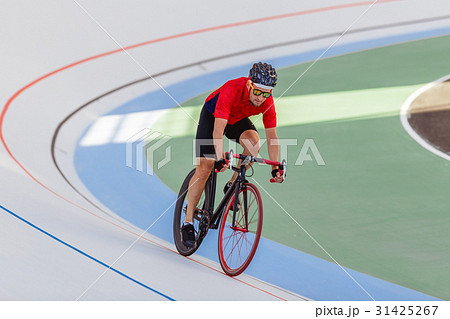 Active man on white velodrome outdoor Active man on white velodrome outdoor 31425267