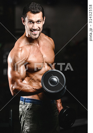 Handsome power athletic man on diet training pumping up muscles Handsome power athletic man on diet training pumping up muscles 31432558
