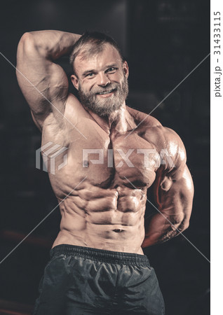 Caucasian sexy fitness model in gym close up abs. 31433115