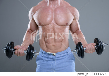 Handsome power athletic man on diet training pumping up muscles Handsome power athletic man on diet training pumping up muscles 31433274