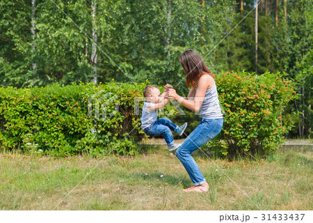 mother and son have fun playing in park. Littkek 31433437