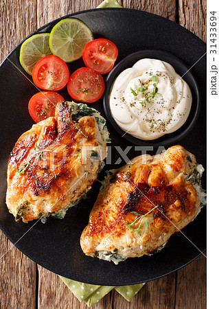 Chicken fillet stuffed with cheese and spinach 31433694