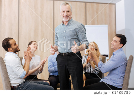 Cheerful handsome man showing thumbs up gesture 31439789
