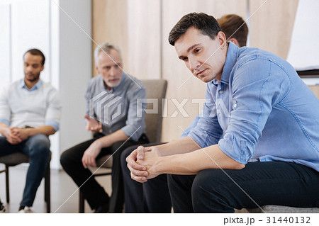Nice thoughtful man sitting on the chair 31440132