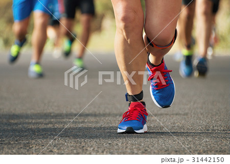 Marathon running race in the light of evening 31442150