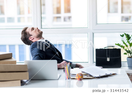 Cheerless depressed man is tired from work Cheerless depressed man is tired from work 31443542