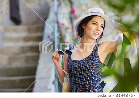 attractive woman tourist with hat in old european town attractive woman tourist with hat in old european town 31443757