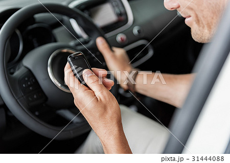 Male arm holding digital device 31444088