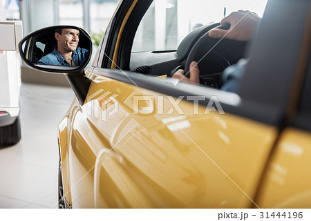 Looking glass glancing happy man 31444196