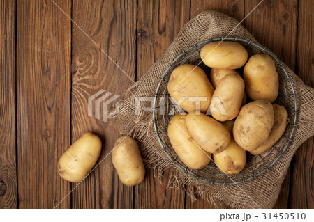 Fresh potatoes in basket Fresh potatoes in basket 31450510