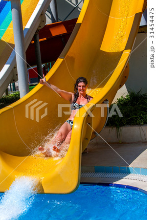 Swimming pool slides for woman on water slide at 31454475