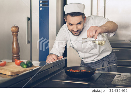 Man japanese restaurant chef cooking in the 31455462