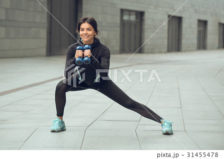Young woman active exercise workout on street 31455478