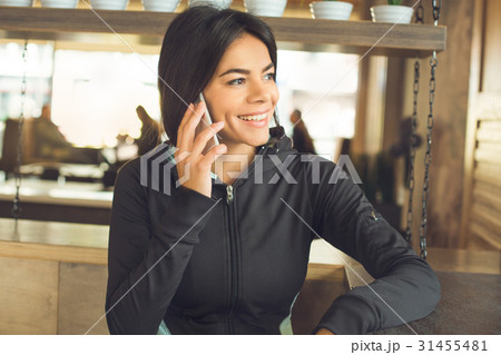 Young woman sitting indoor sportswear healthy 31455481