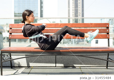 Young woman active exercise workout on street 31455484