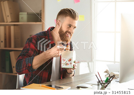 Young man architect working in the office Young man architect working in the office 31455815