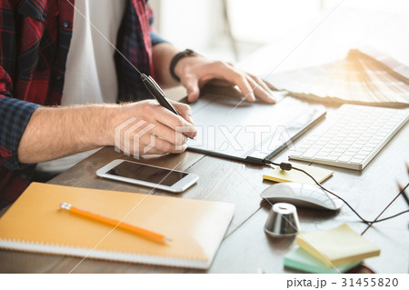 Young man architect working in the office Young man architect working in the office 31455820
