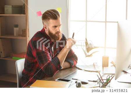 Young man architect working in the office Young man architect working in the office 31455821