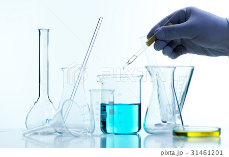 Liquid drop from laboratory glass pipette to test tube Liquid drop from laboratory glass pipette to test tube 31461201