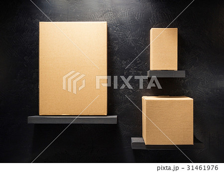 cardboard box on wooden shelf 31461976
