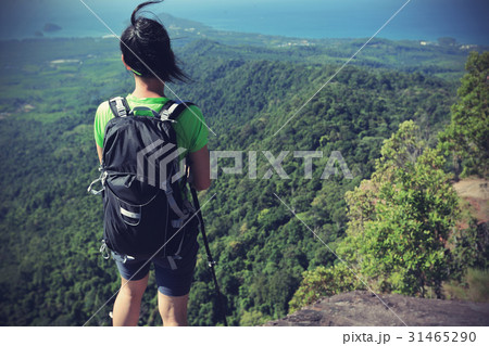 young woman enjoy the view on mountain peak young woman enjoy the view on mountain peak 31465290