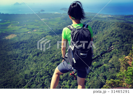 young woman enjoy the view on mountain peak young woman enjoy the view on mountain peak 31465291