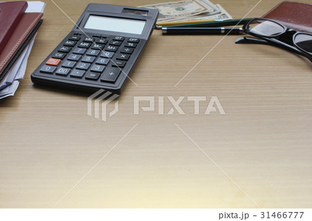 Office desk with US Dollars, smartphone  31466777